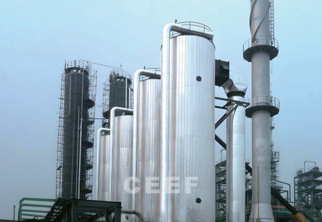Tall insulated CEEF 16 to 21 MW thermal oil and molten salt heaters at the Hebei Jingu waste oil recycling and biodiesel plant
