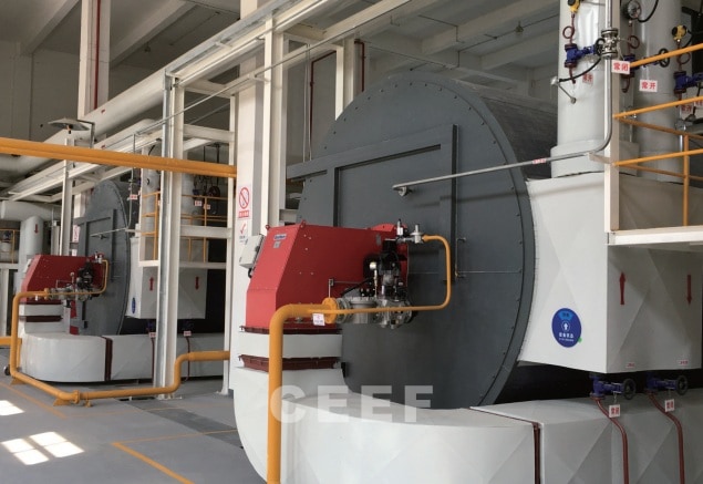 CEEF 7 to 12 MW gas-fired thermal oil heaters with red burners at a BYD copper-clad laminate coating line