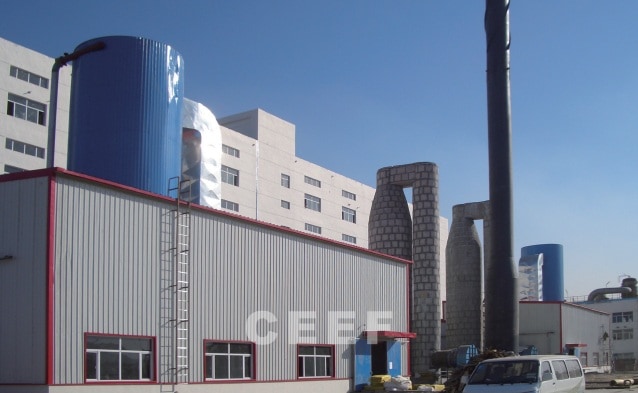 CEEF coal-fired and gas-fired molten salt heater plant with tall flue stacks serving solid caustic soda lines at Bertrams and Junzheng