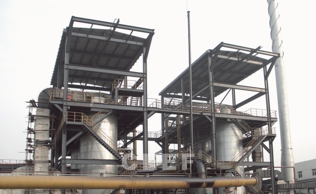 Two CEEF molten salt heater towers with steel platforms at a solid caustic soda evaporation plant for Bozhang and Zhongtai