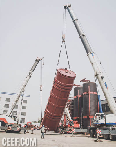 Heavy lifting and loading of a large industrial hot oil heater boiler body at CEEF manufacturing facility