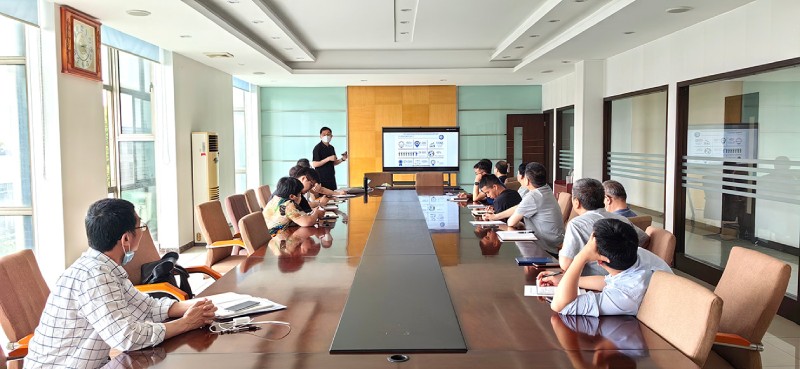 An invited certification specialist presenting on EU CE certification and PED standards to CEEF engineers and managers seated around a long conference room table.