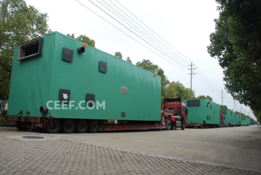 A convoy of heavy-duty trucks transporting large-capacity CEEF thermal fluid heaters for industrial installation